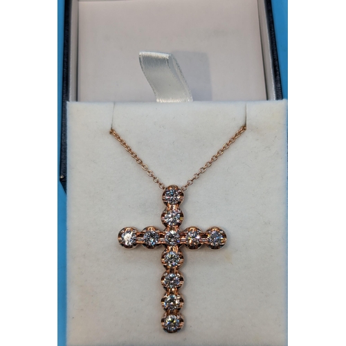 483 - 9ct rose gold cross set with round brilliant cut diamonds on a 9ct rose gold chain.  Diamonds 3.36ct... 