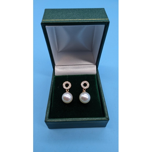 489 - Pair 9ct rose gold pearl and diamond drop earrings.  Diamonds 0.15ct.  Boxed