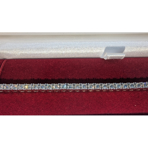 485 - Round brilliant cut diamond line bracelet set in 9ct white gold.  Diamonds 3.77ct.  Boxed