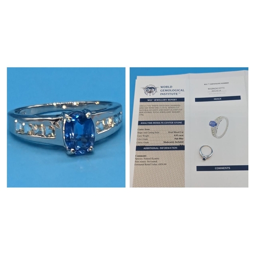 472 - 9ct white gold ring set with oval kyanite and 8 step cut side stones.  Original WGI Cert. no. WGI962... 