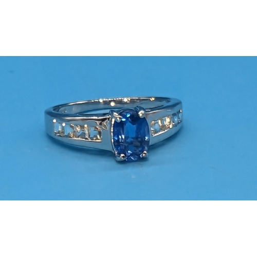 472 - 9ct white gold ring set with oval kyanite and 8 step cut side stones.  Original WGI Cert. no. WGI962... 