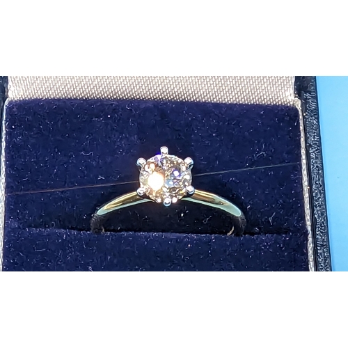 464 - 18ct yellow and white gold 6 claw round brilliant cut solitaire diamond ring.  Diamond 1.01ct.   Box... 