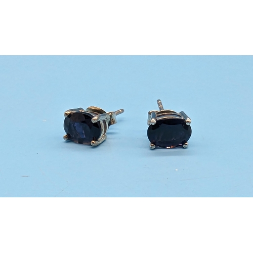 521 - Pair oval iolite studs in silver