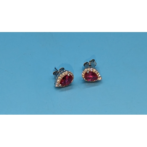 520 - Pair of silver cluster studs set with pear shaped red cubic zirconia and white round cubic zirconia ... 