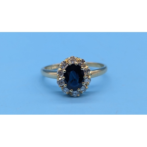 453 - 18ct yellow gold sapphire and diamond cluster ring.  Sapphire 1.50ct.  Diamonds 0.60ct.  WGI Cert. n... 