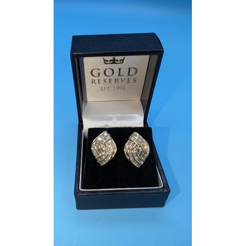 470 - Pair of 9ct yellow gold bagette cut diamond set earrings. Diamonds 2.50ct approx. Boxed.