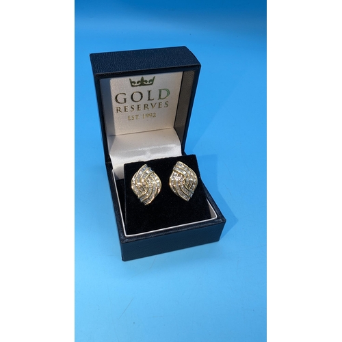 470 - Pair of 9ct yellow gold bagette cut diamond set earrings. Diamonds 2.50ct approx. Boxed.