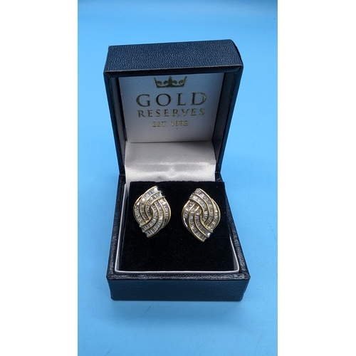 470 - Pair of 9ct yellow gold bagette cut diamond set earrings. Diamonds 2.50ct approx. Boxed.