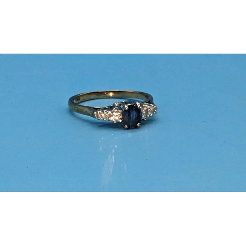 475 - 9ct yellow and white gold oval sapphire and diamond ring. Sapphire 0.50ct. Diamonds 0.25ct.