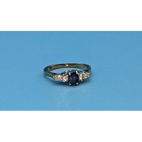 475 - 9ct yellow and white gold oval sapphire and diamond ring. Sapphire 0.50ct. Diamonds 0.25ct.