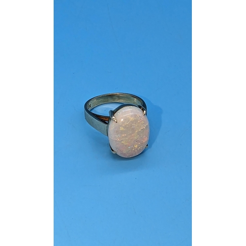 458 - 14ct yellow gold ring set with large oval opal gemstone.   Opal approx. 3.00ct