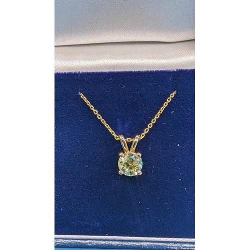 451 - 18ct yellow gold pendant set with a round brilliant cut diamond on a gold plated silver chain.  Diam... 