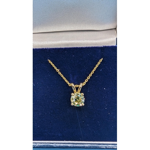 451 - 18ct yellow gold pendant set with a round brilliant cut diamond on a gold plated silver chain.  Diam... 