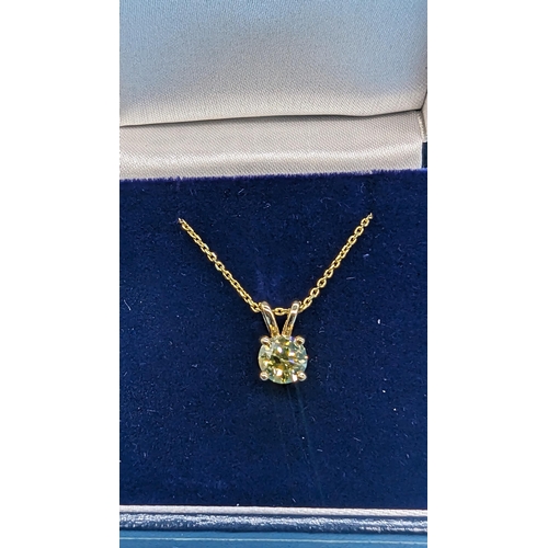 451 - 18ct yellow gold pendant set with a round brilliant cut diamond on a gold plated silver chain.  Diam... 