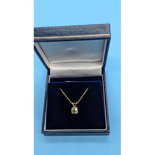 451 - 18ct yellow gold pendant set with a round brilliant cut diamond on a gold plated silver chain.  Diam... 