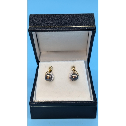 491 - Pair of 9ct yellow gold purple/grey pearl and diamond earrings.  Boxed