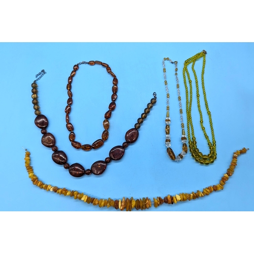 580 - An Amber Necklace and Other Vintage Necklaces.