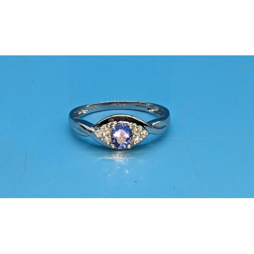 462 - A 14ct White Gold, Diamond and Tanzanite Ring.