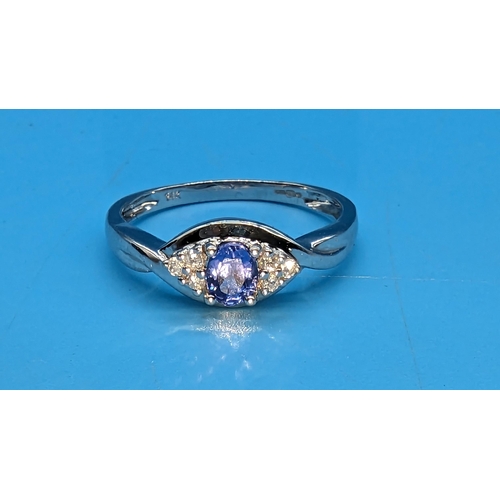 462 - A 14ct White Gold, Diamond and Tanzanite Ring.