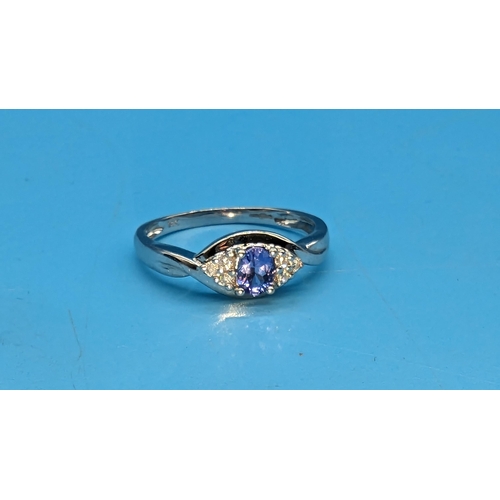 462 - A 14ct White Gold, Diamond and Tanzanite Ring.