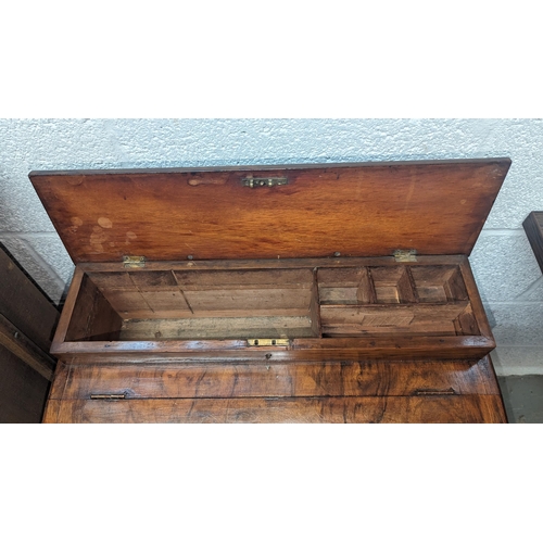 391 - An Antique and Inlaid Small Davenport Desk.