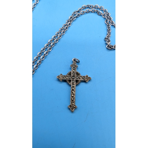 582 - A White Metal Marquisite Cross and White Metal Necklace.