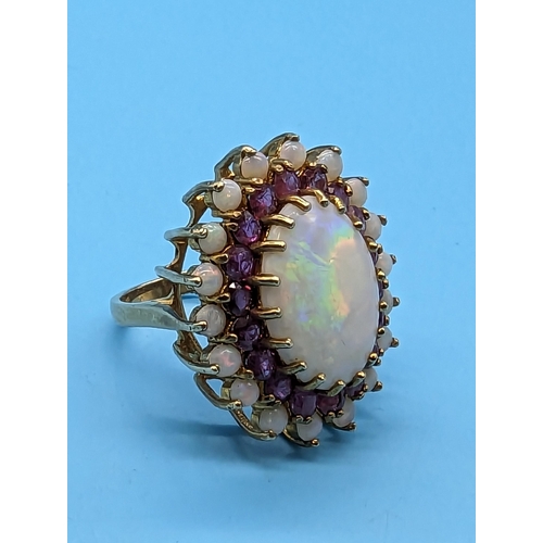 459 - A Large White Opal and Amethyst Cocktail Ring in a 9ct Yellow Gold Setting.