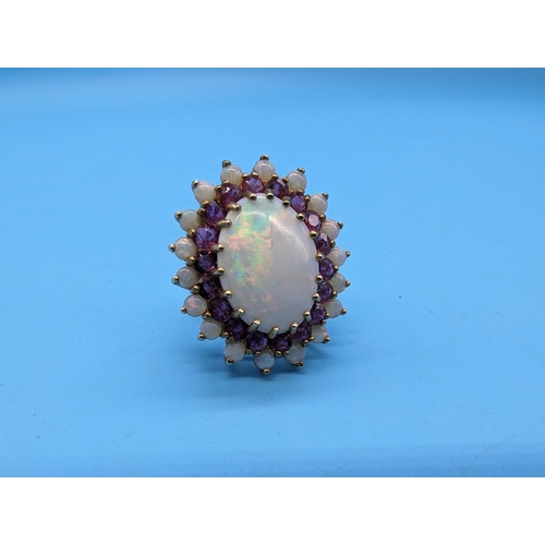 459 - A Large White Opal and Amethyst Cocktail Ring in a 9ct Yellow Gold Setting.