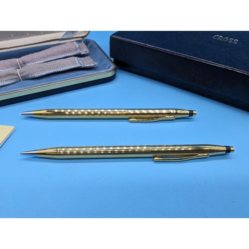 494 - An Engraved Pair of 18ct Gold Cross Ballpoint Pen and Pencil.