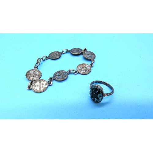 535 - A Silver Ring and a Vintage Coin Bracelet.