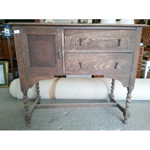 385 - An Antique Oak Buffet Cabinet with Turned Legs.