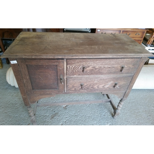 385 - An Antique Oak Buffet Cabinet with Turned Legs.