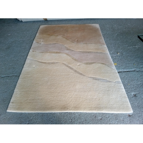 281 - A Wool Rug in Sandy Shades, 180cm x 120cm.