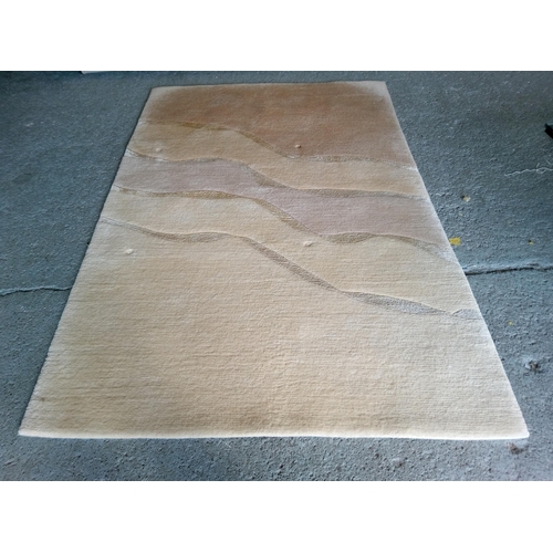 281 - A Wool Rug in Sandy Shades, 180cm x 120cm.