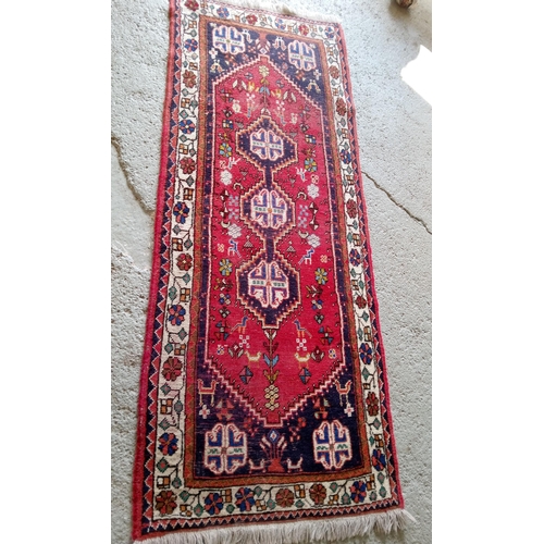 282 - A Handmade Wool Runner, 205cm x 75cm.