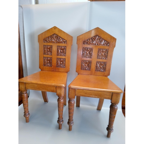 389 - A Pair of Antique Carved Hall Chairs.