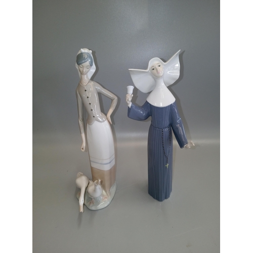 696 - 2 Lladro Figurines, one nun and a girl with geese.