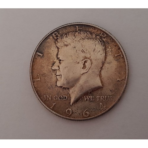 569 - A 1964 Silver Kennedy Half Dollar Coin.