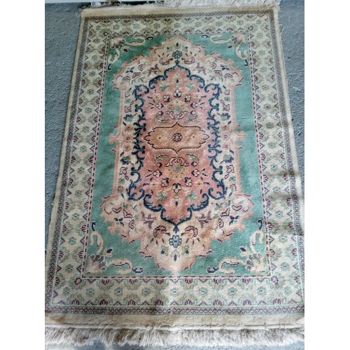 285 - Wool Rug in need of a clean. 190cm x 120cm.