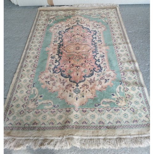 285 - Wool Rug in need of a clean. 190cm x 120cm.