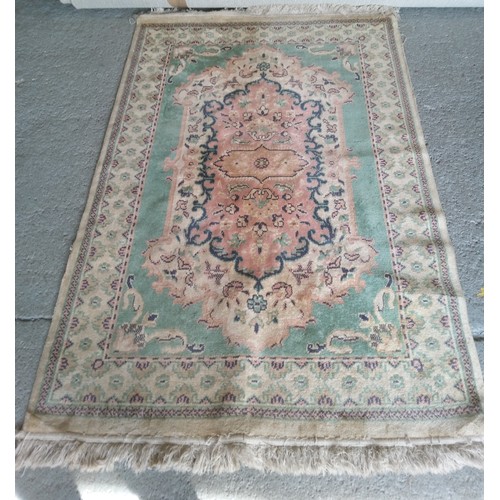 285 - Wool Rug in need of a clean. 190cm x 120cm.