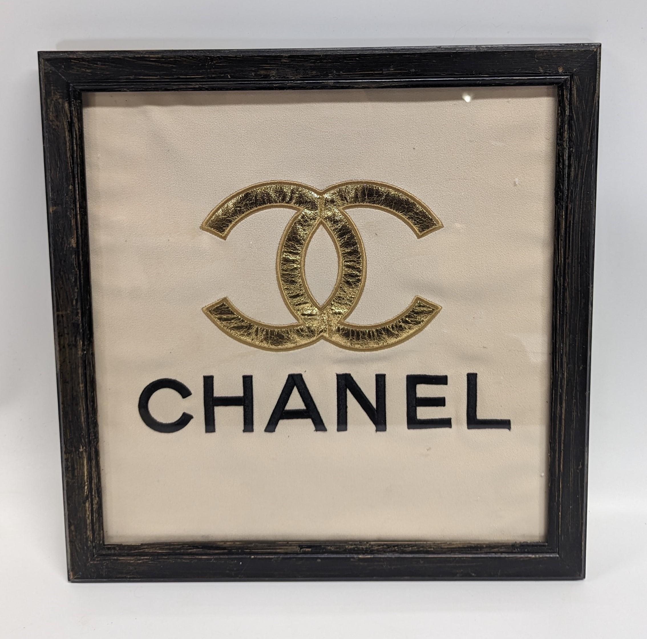 A Chanel Fabric Logo, Framed. 42 x 44cm In Frame.