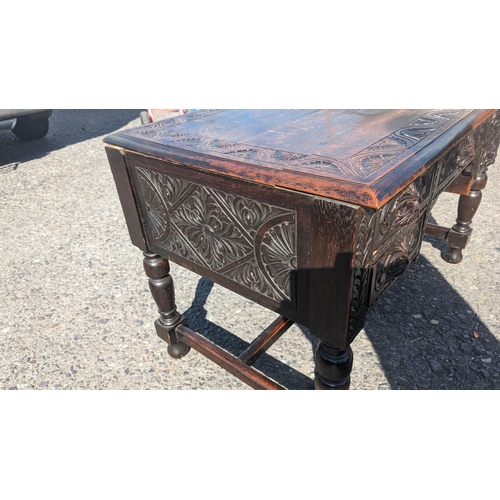 358 - Green Man Carved Oak Desk. 76cm H x 123cm L x 72cm D.