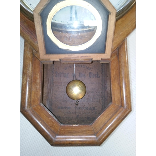 411 - A Vintage Wall Clock with USA Initialled on the face.