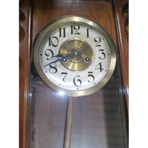 407 - Ornate Dark Wood Wall Clock with Glass Front to Pendulum Case.