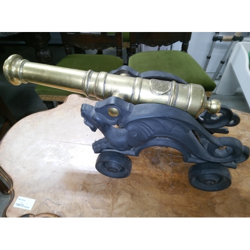 449 - A Heavy Cast Iron and Brass Cannon. 
46cm Length x 18cm Width.