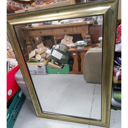 236B - A Black and Gilt Framed Bevel Glass Mirror 89 x 63cm.