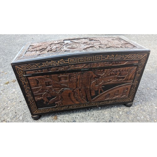 357 - Heavily Carved Chinese Camphor Wood Chest with Drawers on Bun Feet.