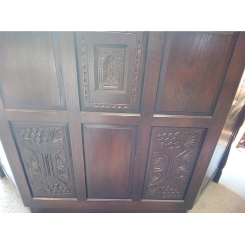 356 - A Heavy Oak Corner Bar with Carved Details and Leaded Glass Cupboard Doors (2 Panes Cracked).