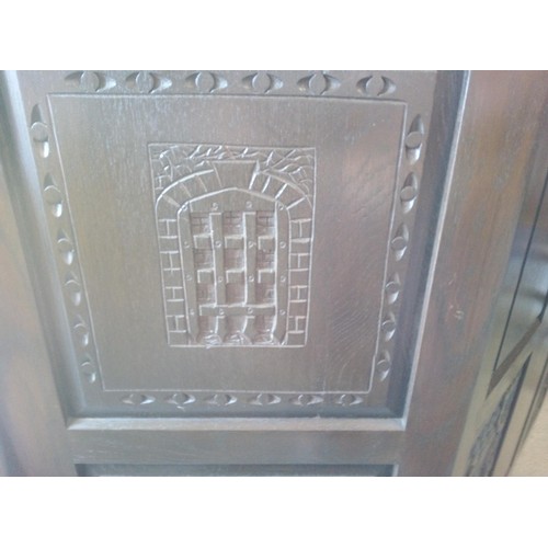 356 - A Heavy Oak Corner Bar with Carved Details and Leaded Glass Cupboard Doors (2 Panes Cracked).